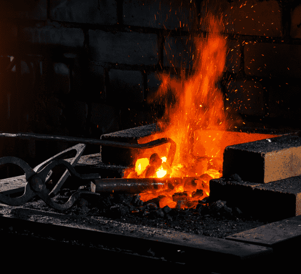Hot coals and flames in a workshop.
